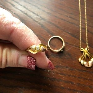 Black hills gold necklace and two rings.